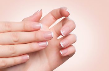 Beautiful Woman Hands. Female hands with french manicure.